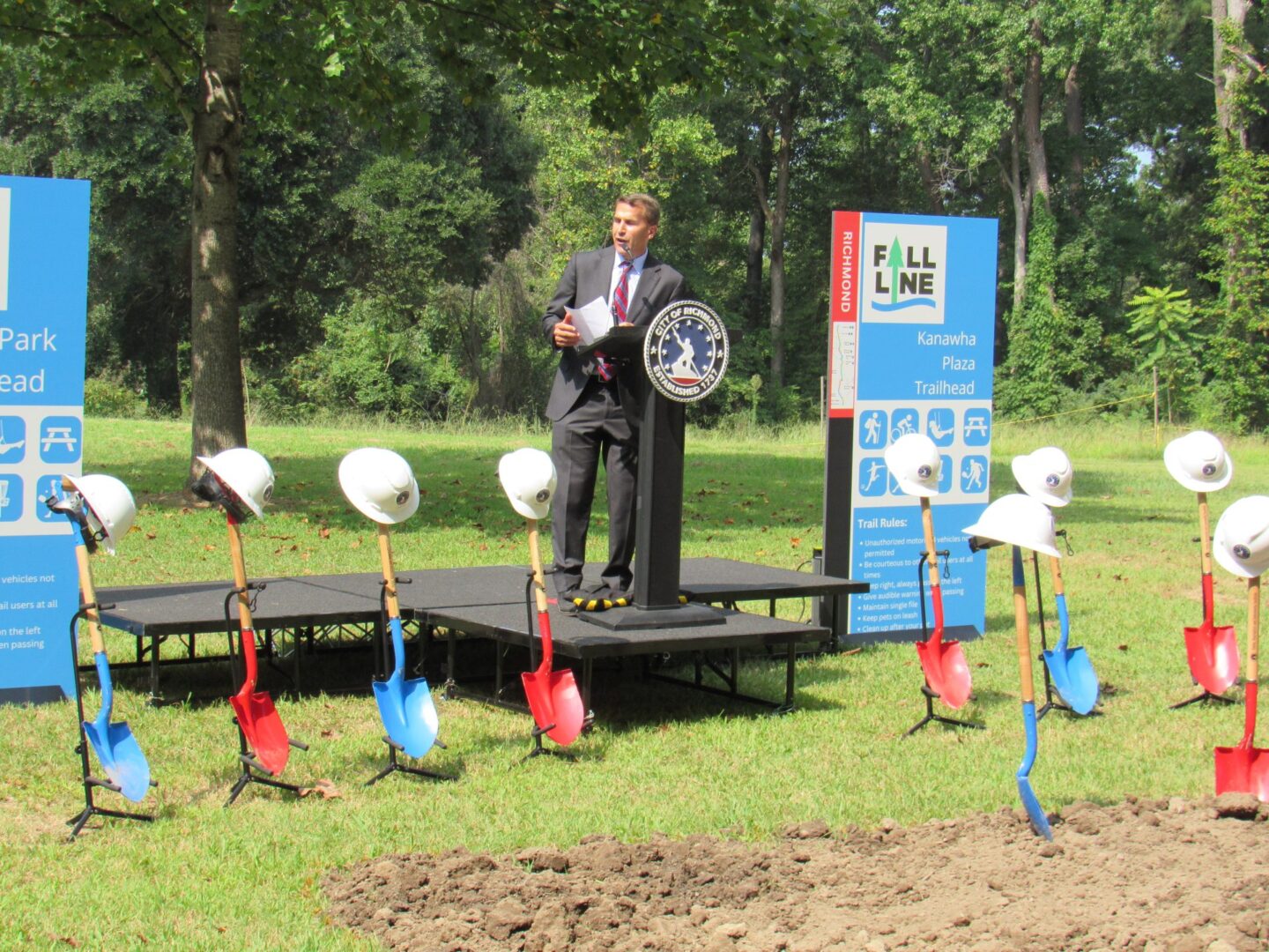 Jon Lugbill, Executive Director of Sports Backers, delivers opening remarks at the ceremonial groundbreaking of the Fall Line trail in Bryan Park.